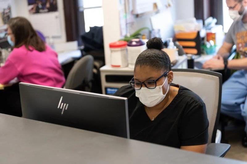 a woman at a computer desk